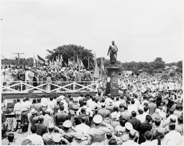 President Harry S. Truman and other dignitaries on the reviewing platform, Bolivar, Missouri. Everyone is standing... - NARA - 199922