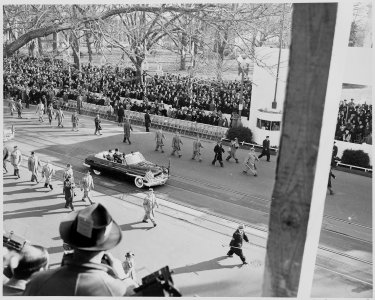 President Truman and Vice President Alben Barkley ride in their limousine to the reviewing stand for the inaugural... - NARA - 200039
