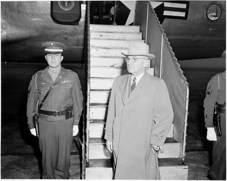President Truman at the bottom of the stairs leading to the presidential airplane. He is leaving for a vacation at... - NARA - 199672