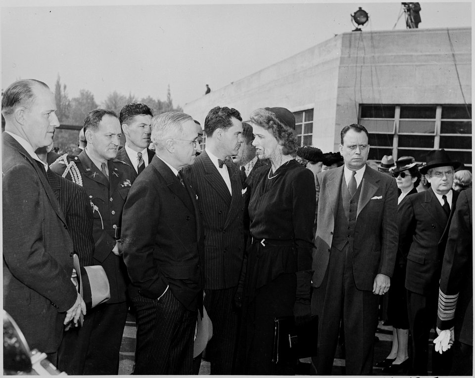 President Harry S.Truman talks to Anna Roosevelt, President Roosevelt's daughter, during the funeral ceremony for... - NARA - 199071
