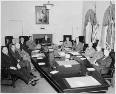 President Truman and his cabinet in the Cabinet Room of the White House. Clockwise around table from left, Secretary... - NARA - 199653 photo