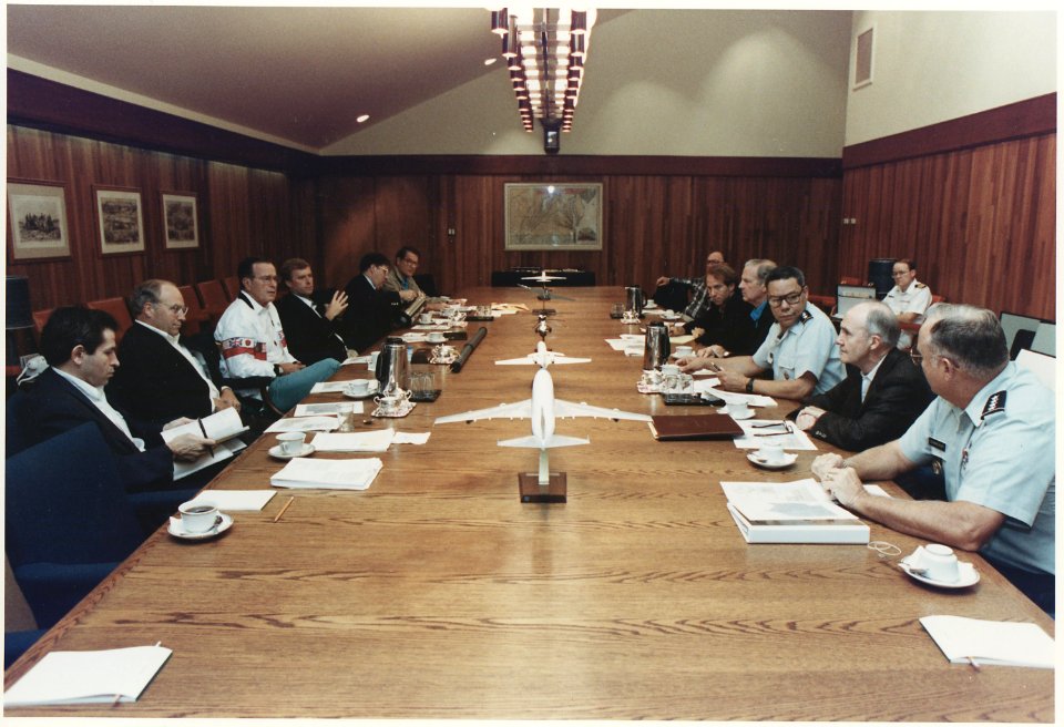 President Bush meets with National Security Advisors regarding Iraq's invasion of Kuwait in Aspen Lodge at Camp David - NARA - 186418
