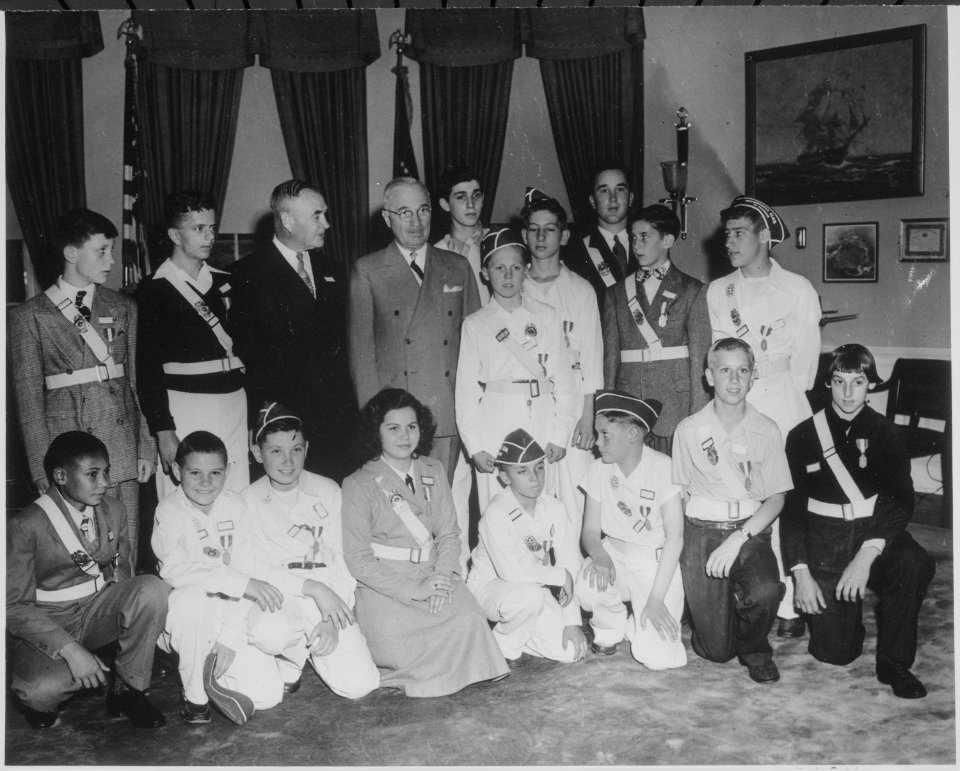 President Truman and Kansas City friend Lou Holland in the oval office with the boys and girls of the Youth Safety... - NARA - 199748