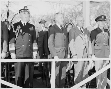 President Truman attends the Army Day parade in Washington, D. C. He is standing second from right, between two... - NARA - 199613