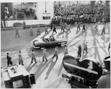 President Truman and Vice President Alben Barkley ride in a limousine to the reviewing stand for the inaugural... - NARA - 200040