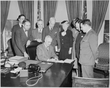 President Truman in the oval office with members of the National Conference on Prevention and Control of Juvenile... - NARA - 199633