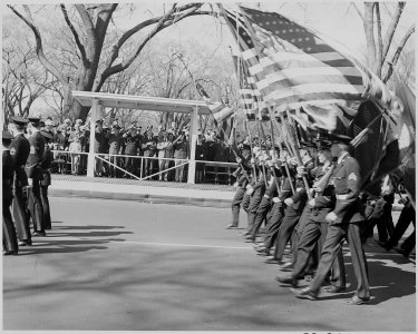 President Truman attends the Army Day parade in Washington, D. C. He is viewing the parade from the reviewing stand. - NARA - 199610