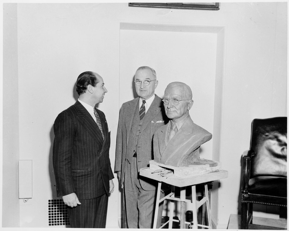 President Truman poses with artist Felix de Weldon and the bust the President has posed for. - NARA - 200020