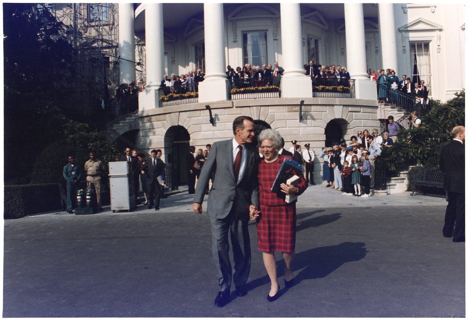President and Mrs. Bush walk towards Marine One to leave for Camp David - NARA - 186438
