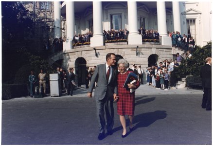 President and Mrs. Bush walk towards Marine One to leave for Camp David - NARA - 186438