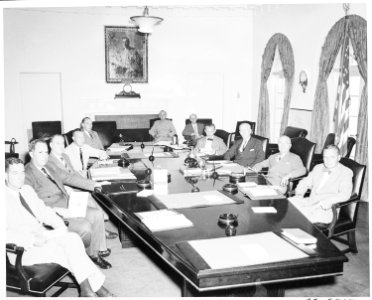 President Truman poses with the National Security Council in the Cabinet Room of the White House. L to R around... - NARA - 199861