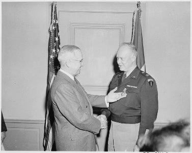 President Truman presents Gen. Dwight Eisenhower with the third Oak Leaf Cluster to the Distinguished Service Medal... - NARA - 199630