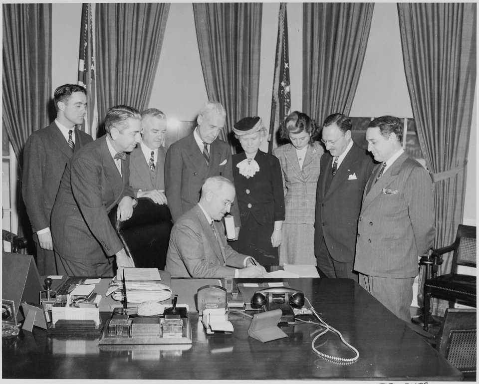 President Truman in the oval office with members of the National Conference on Prevention and Control of Juvenile... - NARA - 199634