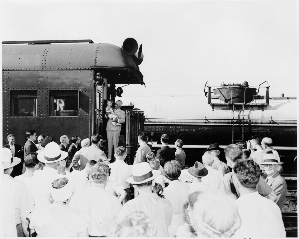 President Truman standing on the rear platform of the presidential train, probably in Bolivar, Missouri. The... - NARA - 199882