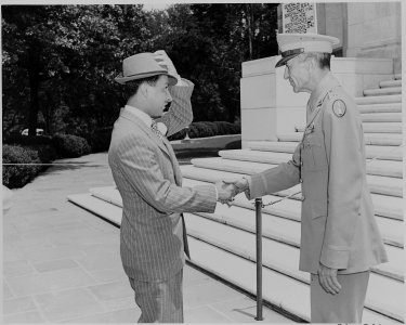 Prince Abdul Ilah of Iraq shakes hands with an American officer during his visit to the United States. - NARA - 199089