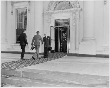 President Truman, in the oval office, receives tickets to the opening baseball game of the Washington Senators and an... - NARA - 199757