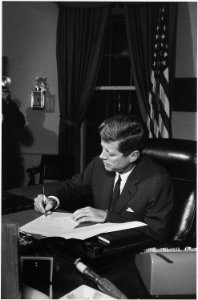 Proclamation Signing, Cuba Quarantine. President Kennedy. White House, Oval Office. - NARA - 194243