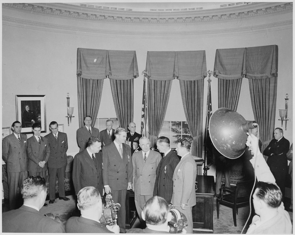 President Truman presents Medal of Merit to four men in the oval office. They are, L to R, W. John Kennedy... - NARA - 199638