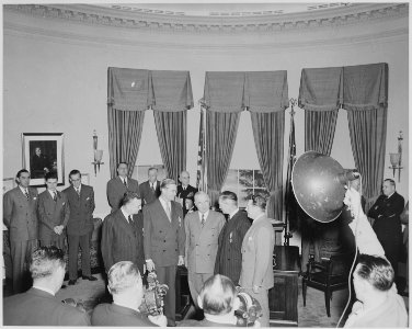 President Truman presents Medal of Merit to four men in the oval office. They are, L to R, W. John Kennedy... - NARA - 199638