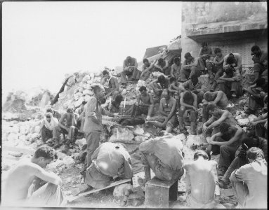 Protestant Chaplain Rufus W. Oakley holding services within a few hundred yards of Japanese positions, well within... - NARA - 532536
