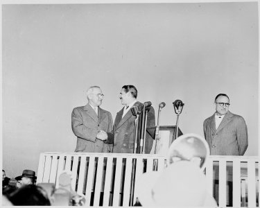 President Truman shakes hands with President Prio Socarras of Cuba in ceremonies at National Airport in Washington... - NARA - 200033