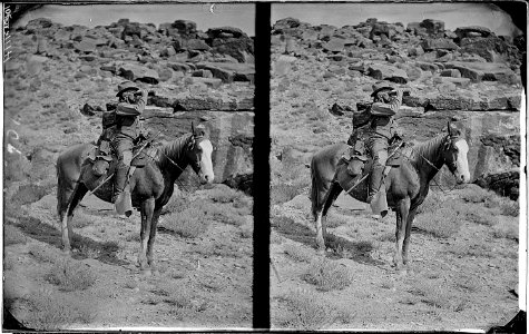 Prof. A.H. Thompson on his horse Old Ute, looking through field glasses, about 1873. Old nos. 441, - NARA - 517924
