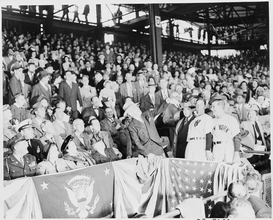 President Truman throws out the first baseball in the opening game at Griffith Stadium in Washington, D. C. between... - NARA - 199754