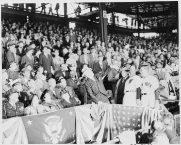President Truman throws out the first baseball in the opening game at Griffith Stadium in Washington, D. C. between... - NARA - 199754