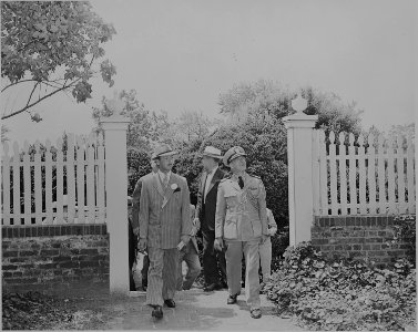Prince Abdul Ilah of Iraq and an American officer walking into a garden area, probably at George Washington's home at... - NARA - 199096