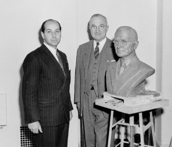 President Truman poses with artist Felix de Weldon and the bust the President has posed for. - NARA - 200019