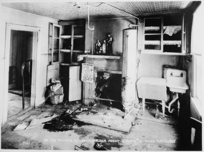 Religious statues, a calendar, and rubbish left behind in the second-floor front room of a vacated Brooklyn housing proj - NARA - 518272 photo