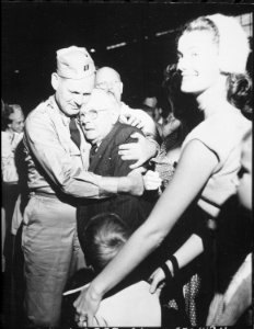 Repatriated Prisoner of War Captain, Frederick Smith is greeted by his father on his arrival at Fort Mason... - NARA - 531432