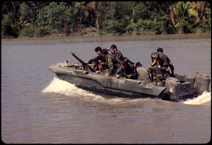 Republic of Vietnam...Members of U.S. Navy Seal Team One move down the Bassac River in a Seal team Assault Boat... - NARA - 558512 photo