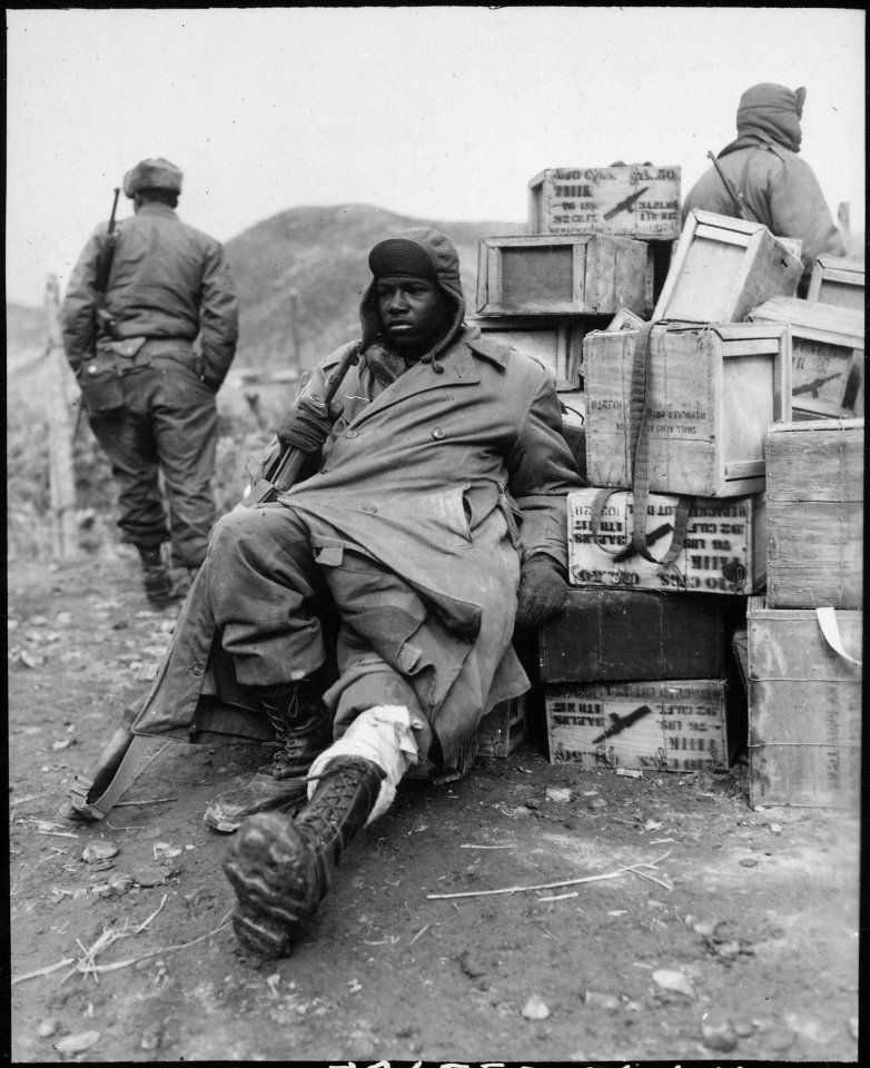 Private First Class Edward Wilson, 24th Infantry Regiment, wounded in leg while engaged in action against the enemy... - NARA - 531399
