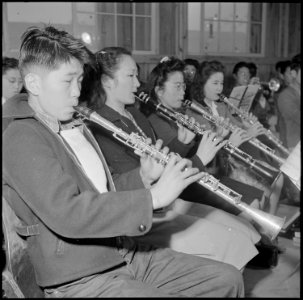 Rohwer Relocation Center, McGehee, Arkansas. A part of the reed section of the High School band in . . . - NARA - 539374