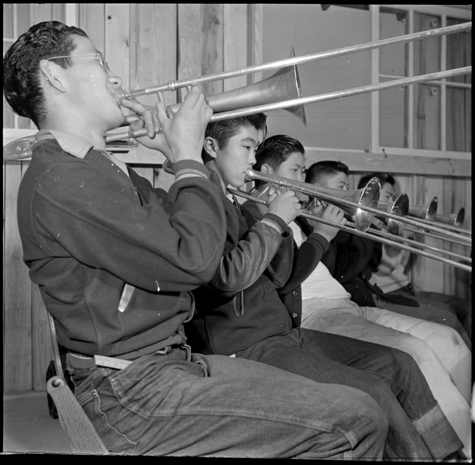 Rohwer Relocation Center, McGehee, Arkansas. A trombone section of the High School Band in a pract . . . - NARA - 539376