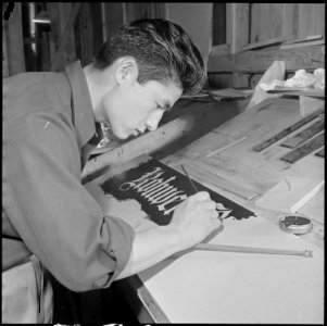 Rohwer Relocation Center, McGehee, Arkansas. Allen Hagio, a former California artist, preparing a . . . - NARA - 539380
