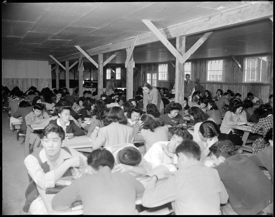 Rohwer Relocation Center, McGehee, Arkansas. Miss Opal Albright, teacher. Study hall. A converted . . . - NARA - 538962