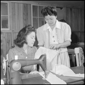 Rohwer Relocation Center, McGehee, Arkansas. In a sewing class at the Rohwer Center schools, Misaye . . . - NARA - 539361 photo
