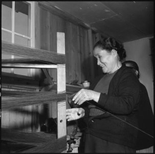 Rohwer Relocation Center, McGehee, Arkansas. This Issei woman is winding yarn in the weaving room a . . . - NARA - 537384