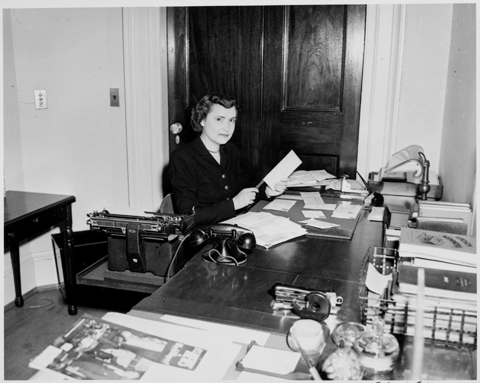 Reathel Odum, secretary to Bess Truman, working at her desk in the White House. - NARA - 199959