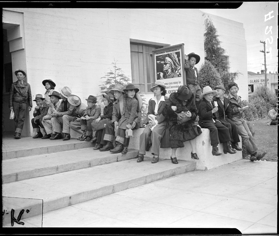 Salinas, California. Evacuees of Japanese ancestry waiting for the bus which will take them to the . . . - NARA - 536194