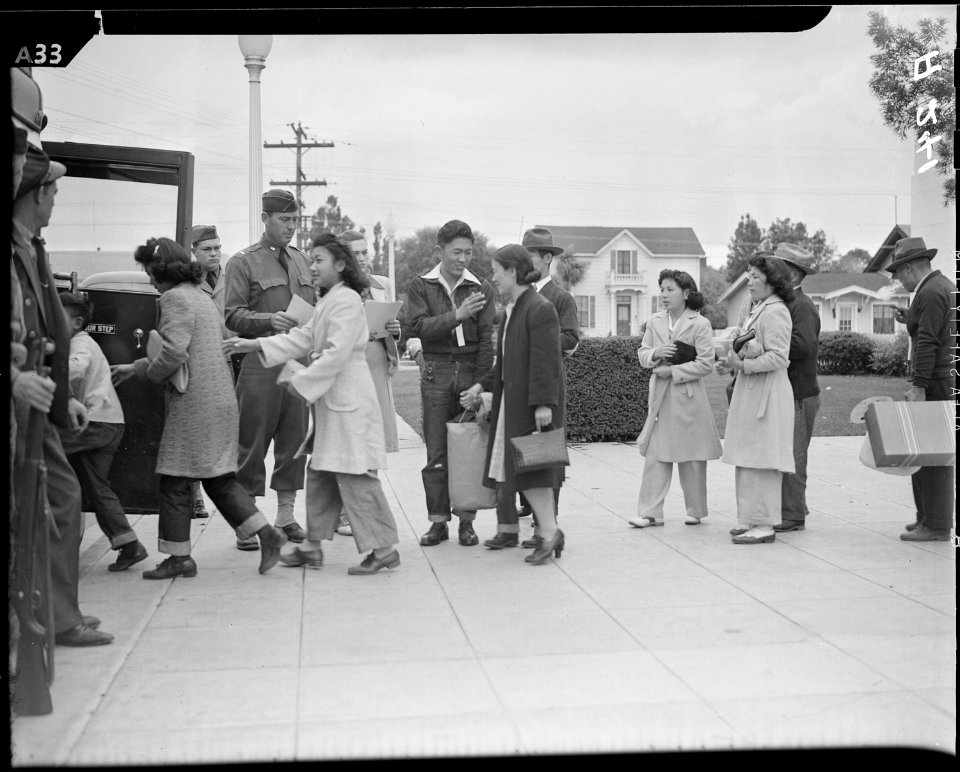 Salinas, California. Evacuees of Japanese ancestry boarding a bus which will take them to the Santa . . . - NARA - 536187