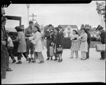 Salinas, California. Evacuees of Japanese ancestry boarding a bus which will take them to the Santa . . . - NARA - 536187