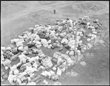 Salinas, California. This baggage belonging to evacuees of Japanese ancestry was brought in by truc . . . - NARA - 536159