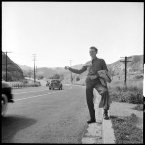 San Fernando, California. Hitch-hiking. This Civilian Conservation Corps boy is returning to camp about thirty miles... - NARA - 532088 photo