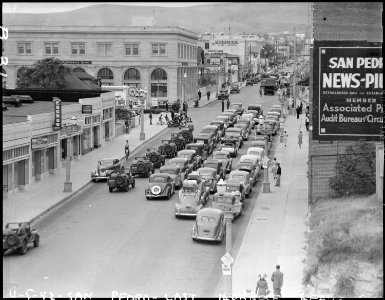 San Pedro, California. A caravan of 74 cars plus many military vehicles, at West Seventh and South . . . - NARA - 536780