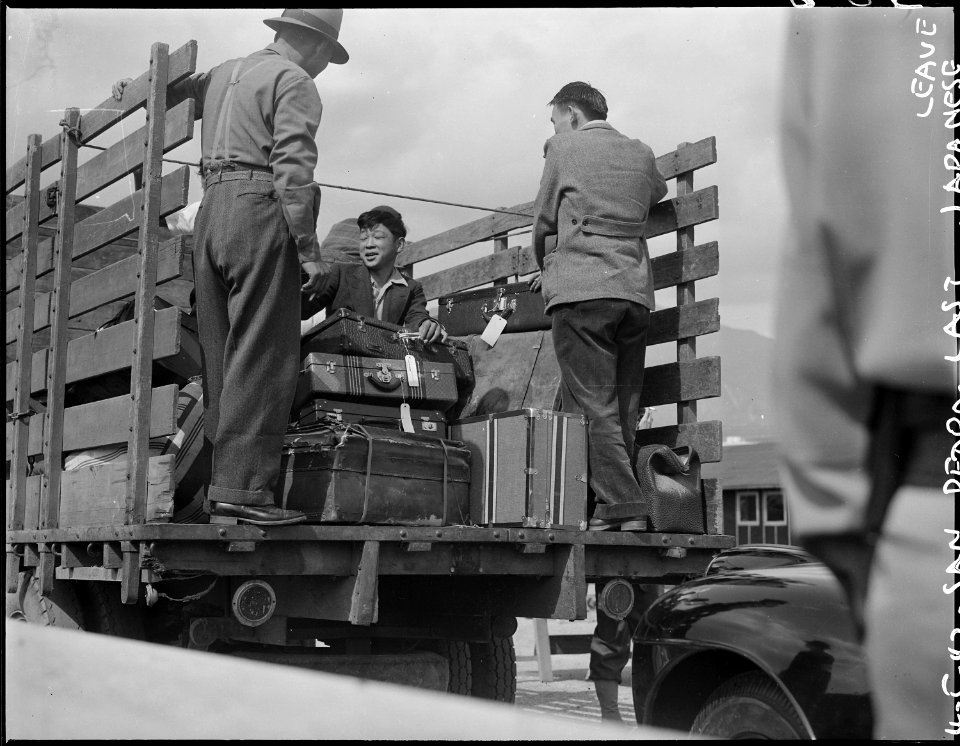 San Pedro, California. Trucks were jammed with suitcases, blankets, household equipment, garden too . . . - NARA - 536774