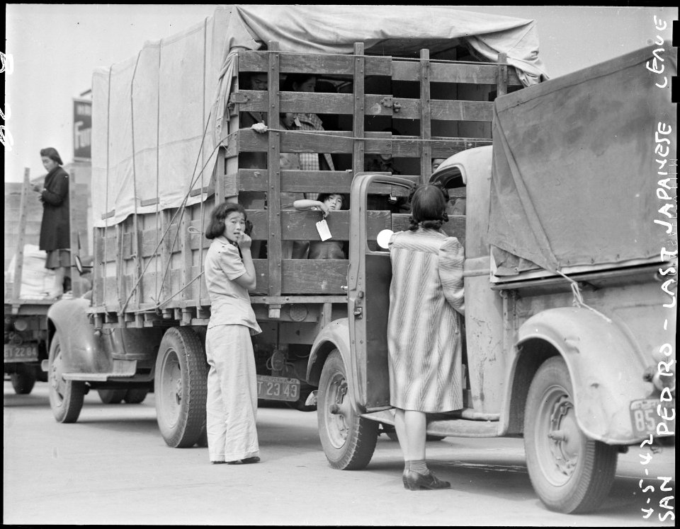 San Pedro, California. Trucks were jammed high with suitcases, blankets, household equipment, garde . . . - NARA - 536778