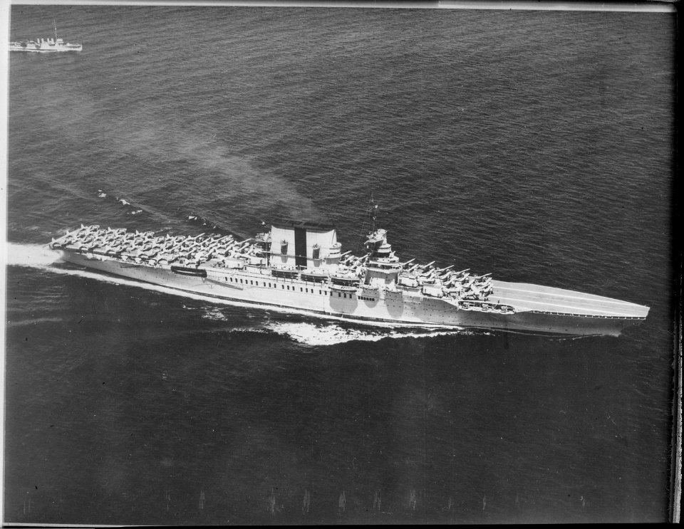 Saratoga (CV3). Aerial, port bow, underway, launching aircraft, 05-31-1934 - NARA - 520810